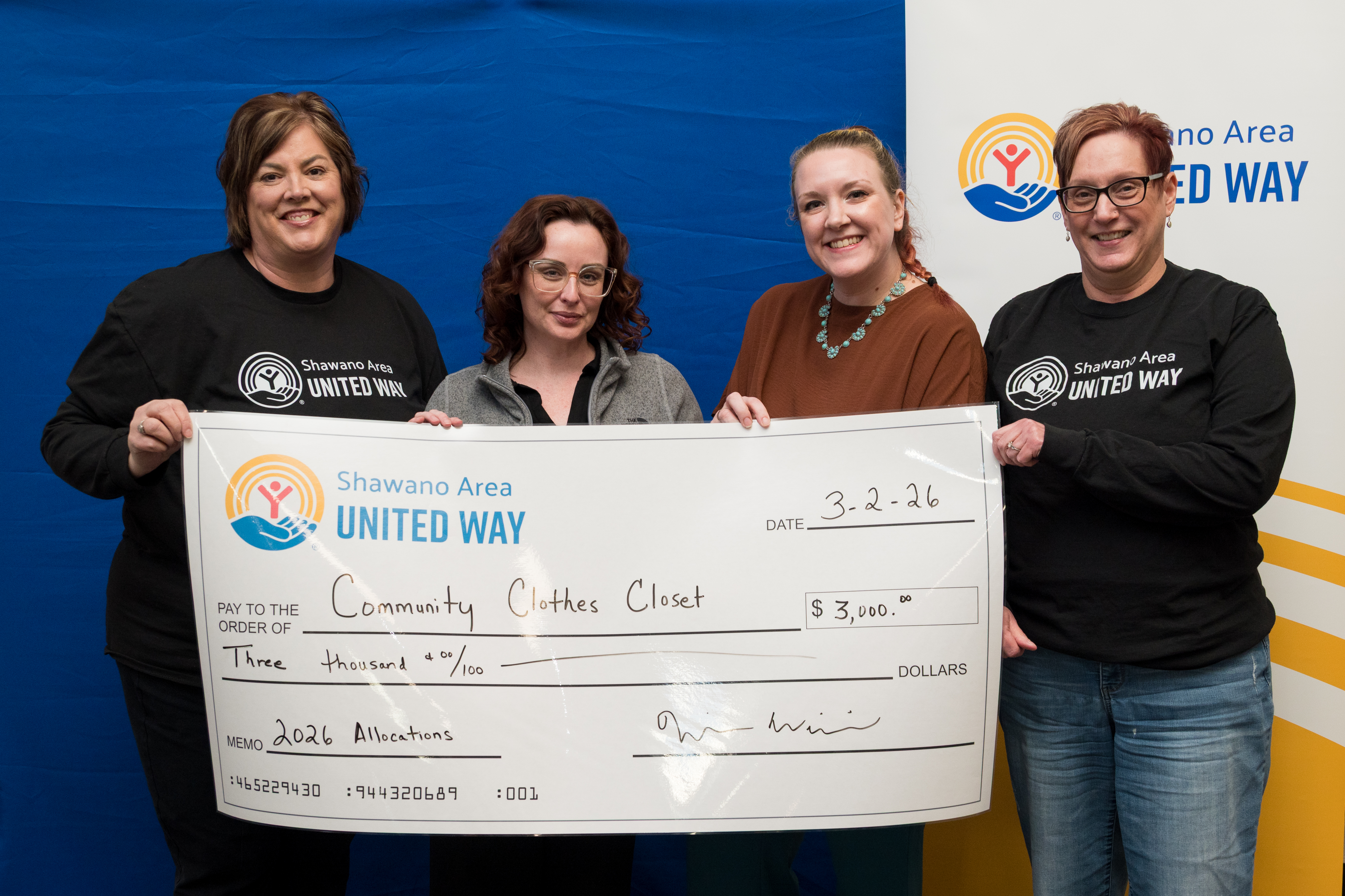 Check presentation to the Community Clothes Closet staff members