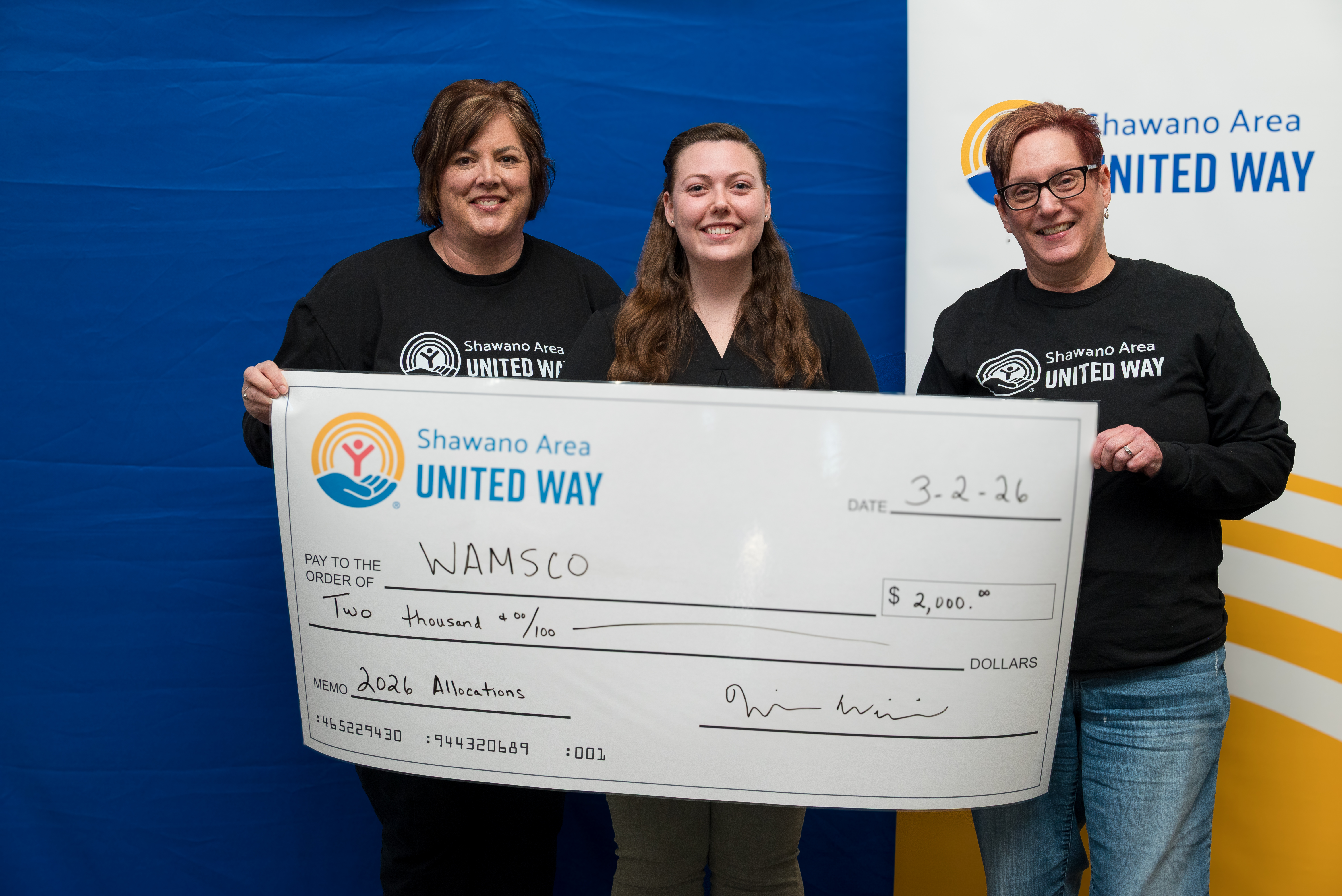 United Way Board Members with WAMSCO Staff at our Allocation Celebration night presenting a check.