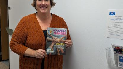 Rhonda Strebel, our Board President, with her copy of the Change Makers publication